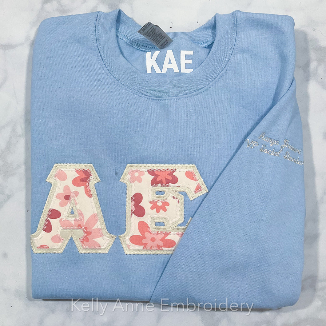 70s Retro Floral in Pink Greek Letters with Cream Border on Light Blue Sweatshirt
