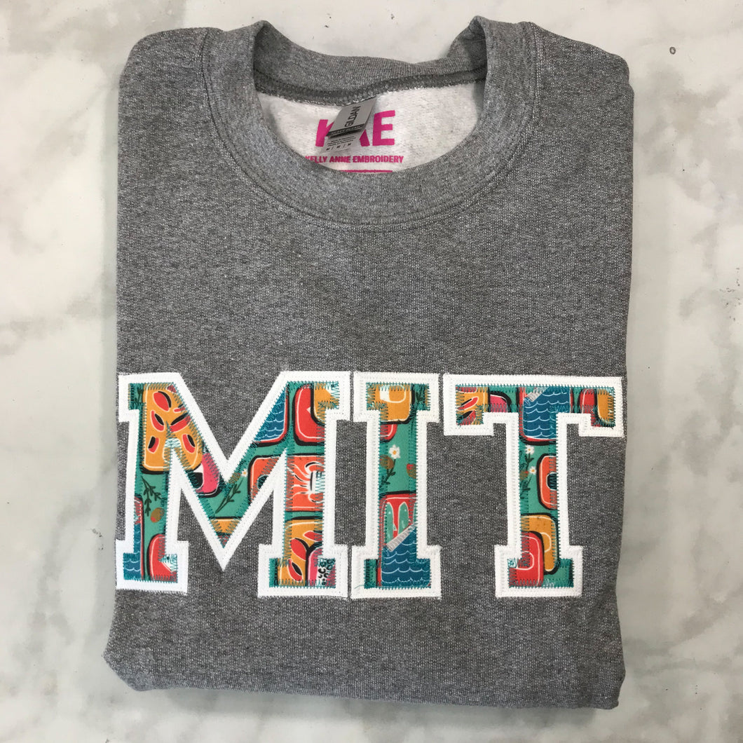 Canned Goods Blue Greek Letters with White Border on Graphite Heather Sweatshirt