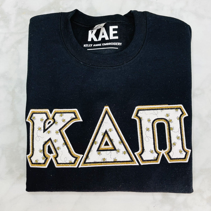 Bees All Over Greek Letters with Gold Glitter Gold border on Black Sweatshirt w/Satin Stitching