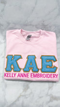 Load image into Gallery viewer, Blue Chenille Greek Letters with Gold Glitter Gold border on Light Pink Sweatshirt
