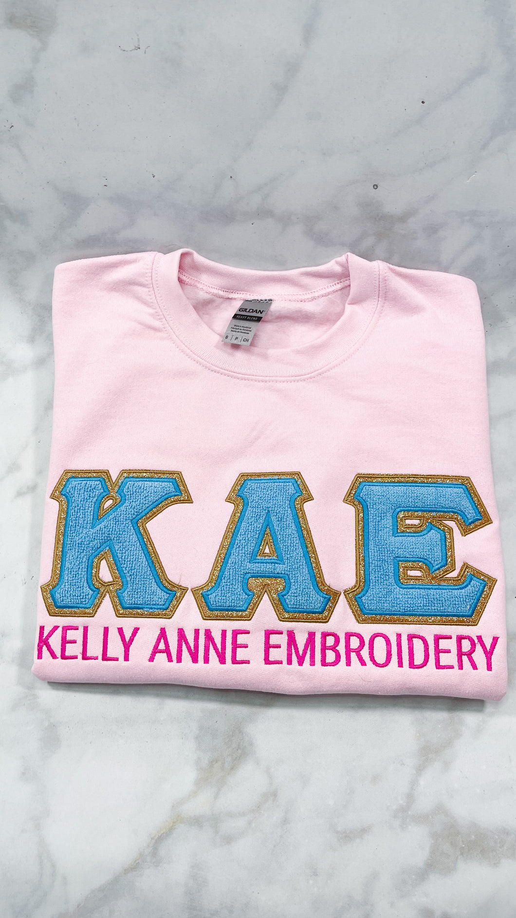 Blue Chenille Greek Letters with Gold Glitter Gold border on Light Pink Sweatshirt