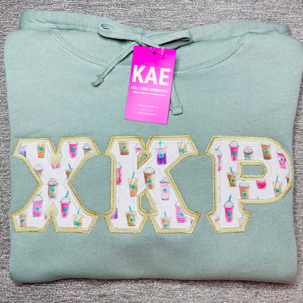COFFEE CUP PARTY Greek Letters with VEGAS GOLD border on SAGE Cropped Hoodie